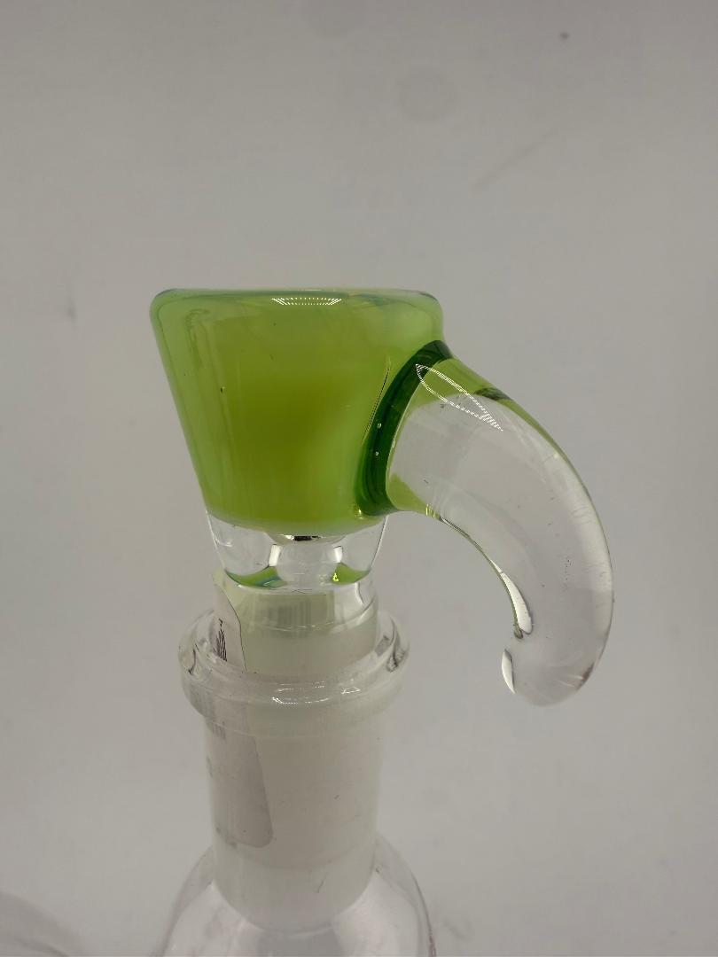 Close-up of a green Glass Distractions martini bowl with horn handle, showcasing craftsmanship and vibrant design.