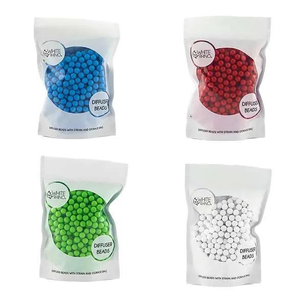 White Rhino Diffuser Beads in blue, red, green, and white bags for smoother smoking experiences.