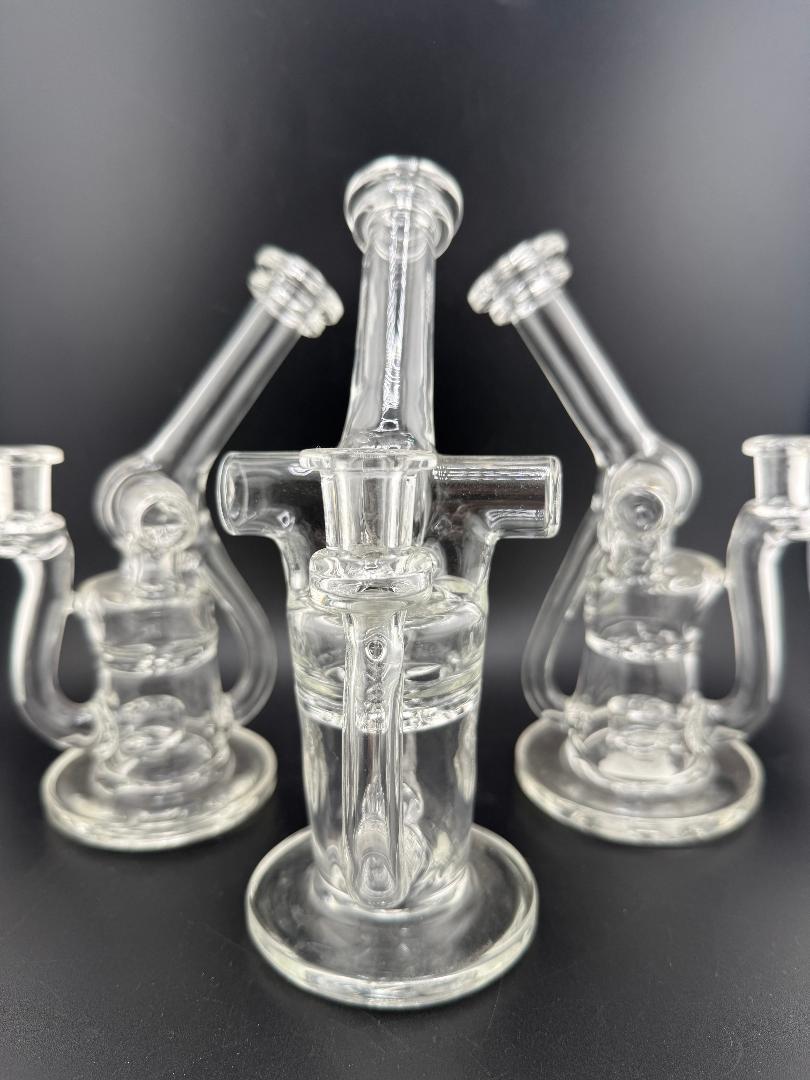 Three Domer Glass Blooper Clear 10mm 90° joints showcased against a black background. Domer Double That Looks Expensive