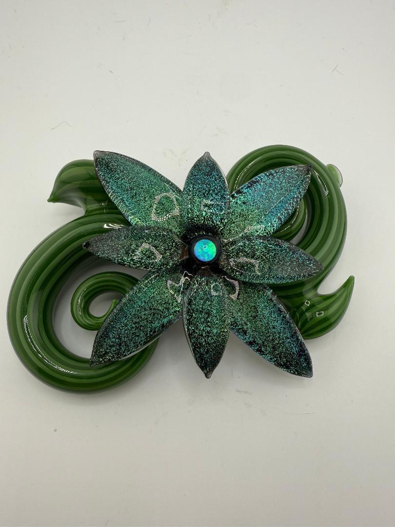Filla John Spring 2025 Dichroic Pipe with green floral design and opal accent, showcasing botanical art craftsmanship.