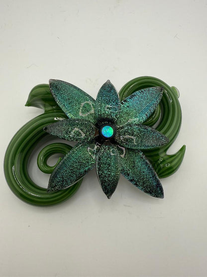 Filla John Spring 2025 Dichroic Pipe with green floral design and opal accent, showcasing botanical art craftsmanship.