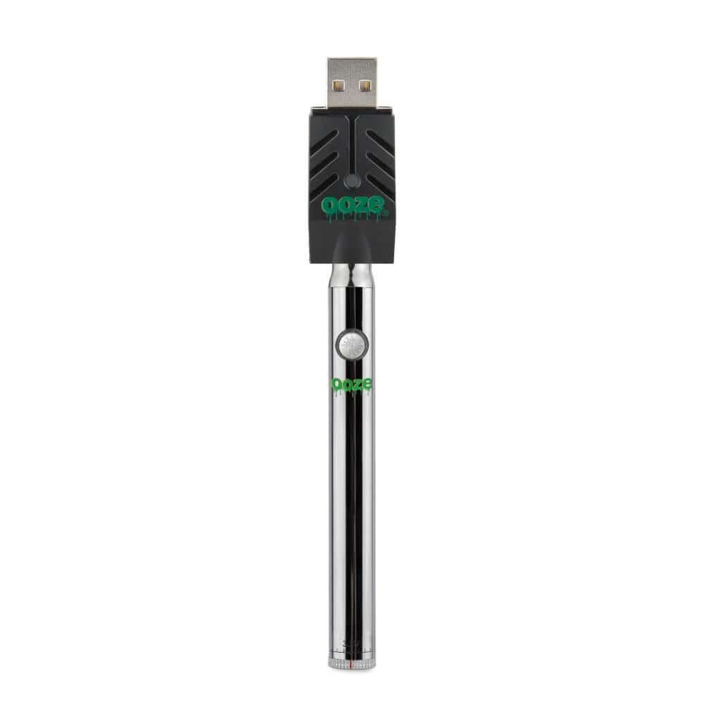 Ooze Twist Pen Slim vape battery with USB charger, sleek design for oil cartridges and wax attachments.