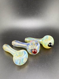 Highgrade glass hand pipes with fumed finish and colorful accents, showcasing a sleek, minimalist design.
