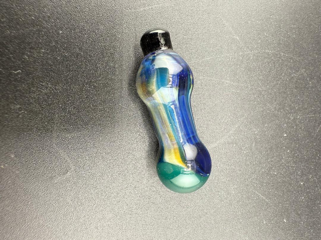 Paulson Pieces Puffco Peak Pro Ball Cap Replacement in blue and green colors on a black surface.