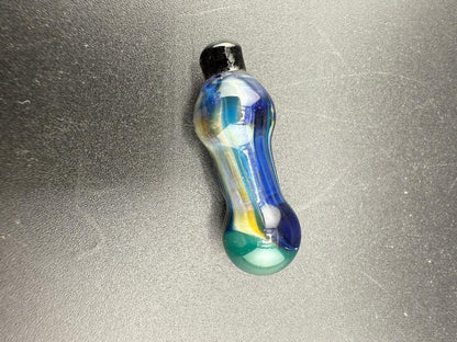Paulson Pieces Puffco Peak Pro Ball Cap Replacement in blue and green colors on a black surface.