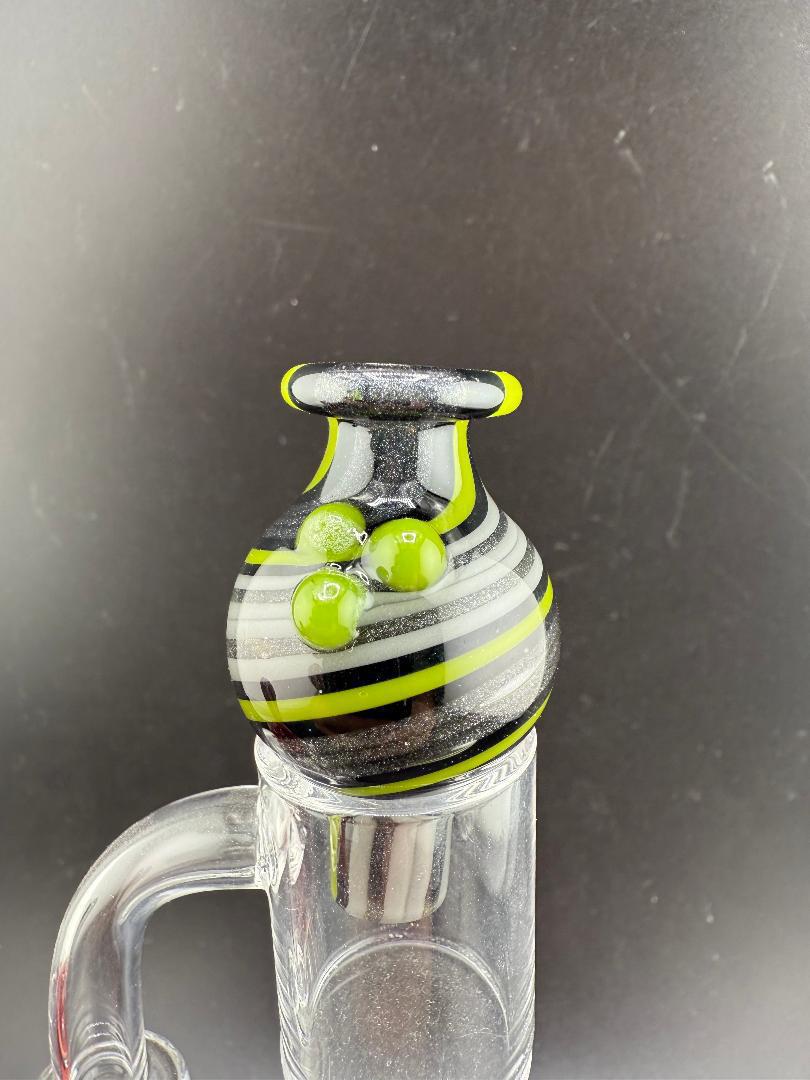 Filla John Line Worked Bubble Cap featuring bold colors and intricate line work, enhancing dabbing setups.