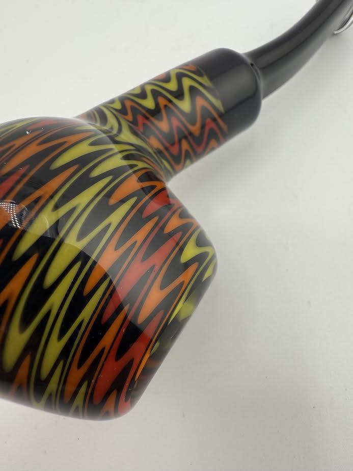 Mcdoogle Wig Wag Ddy Pipe featuring vibrant swirling patterns in red, yellow, and black colors. Perfect for collectors.