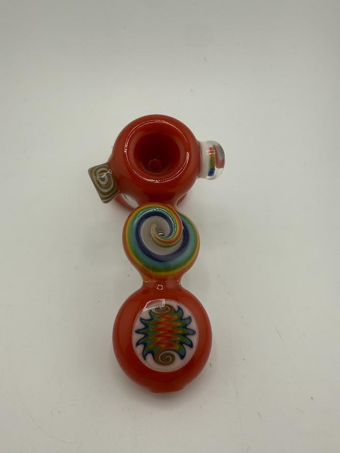 Mcdoogle Worked Hammer Red glass pipe featuring colorful swirl designs and a vibrant red finish.