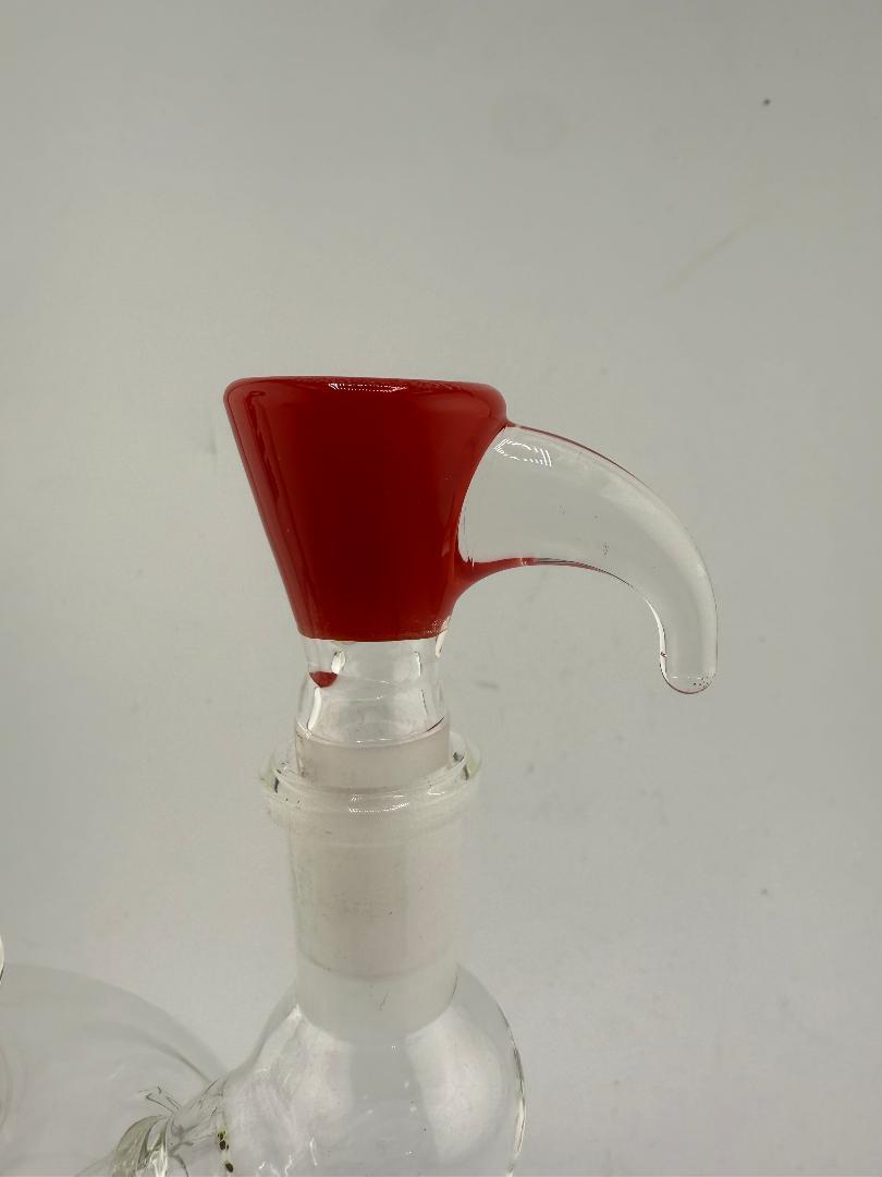 Close-up of a glass bowl with a red horn handle, designed for 14mm fittings, showcasing colorful craftsmanship.