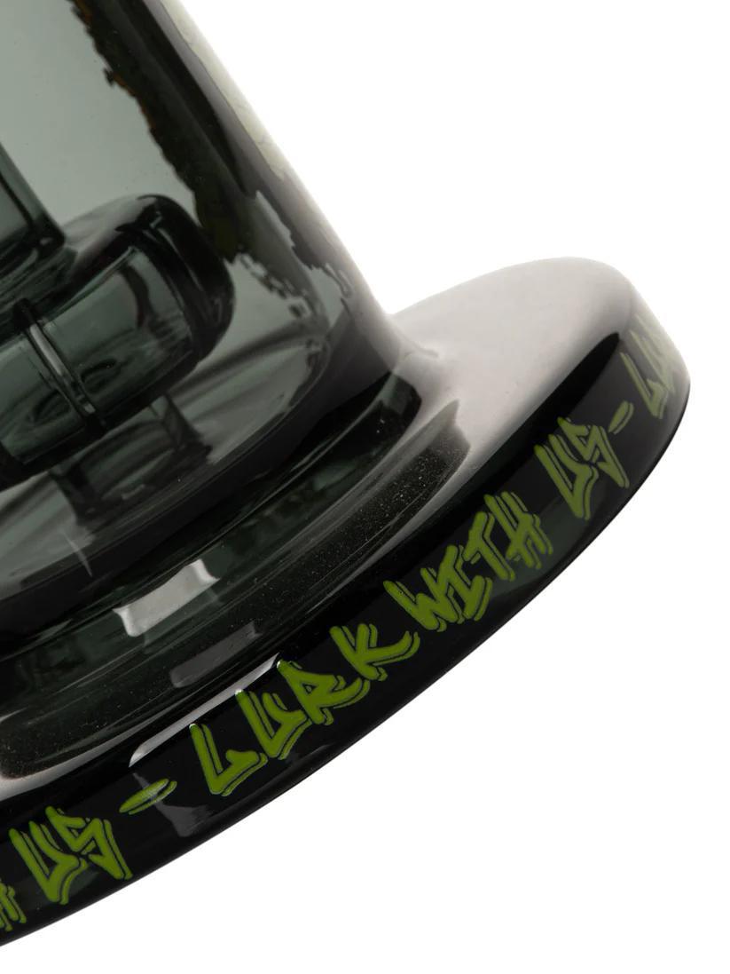 Close-up of Gear Premium x Creature 7.5" concentrate rig with unique artwork and black base featuring spooky text.