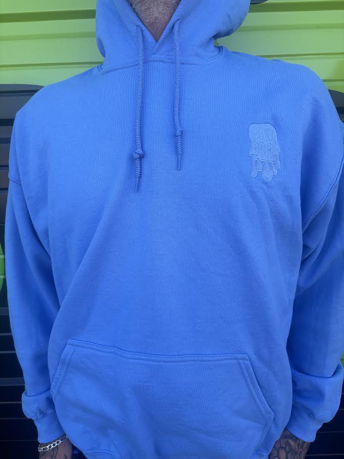 Nikk Drips Hoodie in light blue color, showcasing heavy blend cotton for comfort and style.