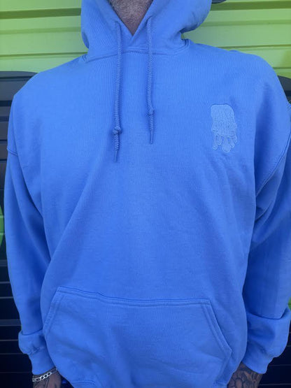 Nikk Drips Hoodie in light blue color, showcasing heavy blend cotton for comfort and style.