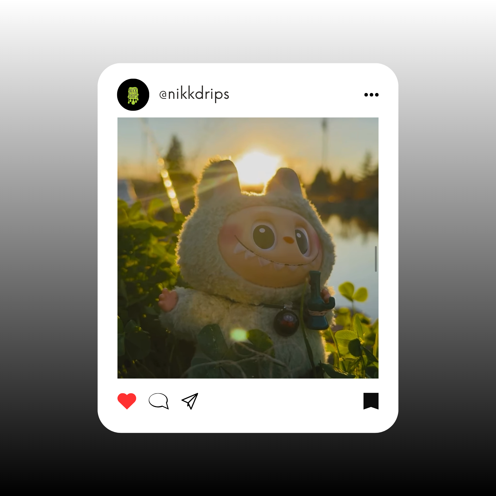 Playful plush toy in a sunset scene, surrounded by greenery, capturing a whimsical outdoor moment.