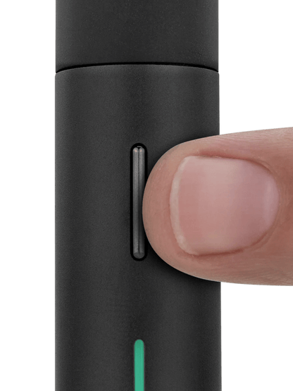 Close-up of Puffco Pivot Mobile Vaporizer with a finger pressing the button, showcasing its sleek design.