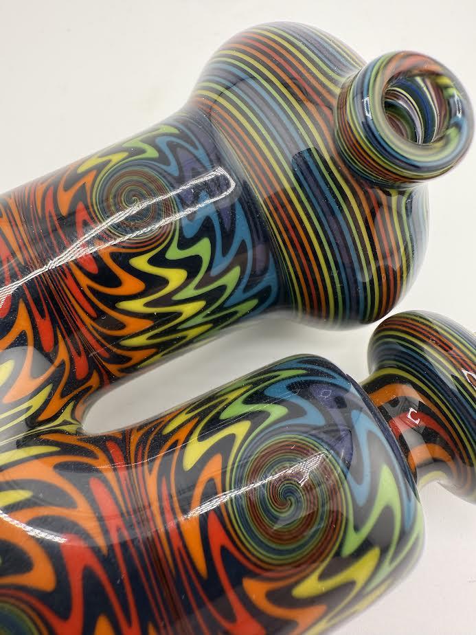 Colorful Mcdoogle Sherlock line work glass piece with vibrant swirls and unique design details.