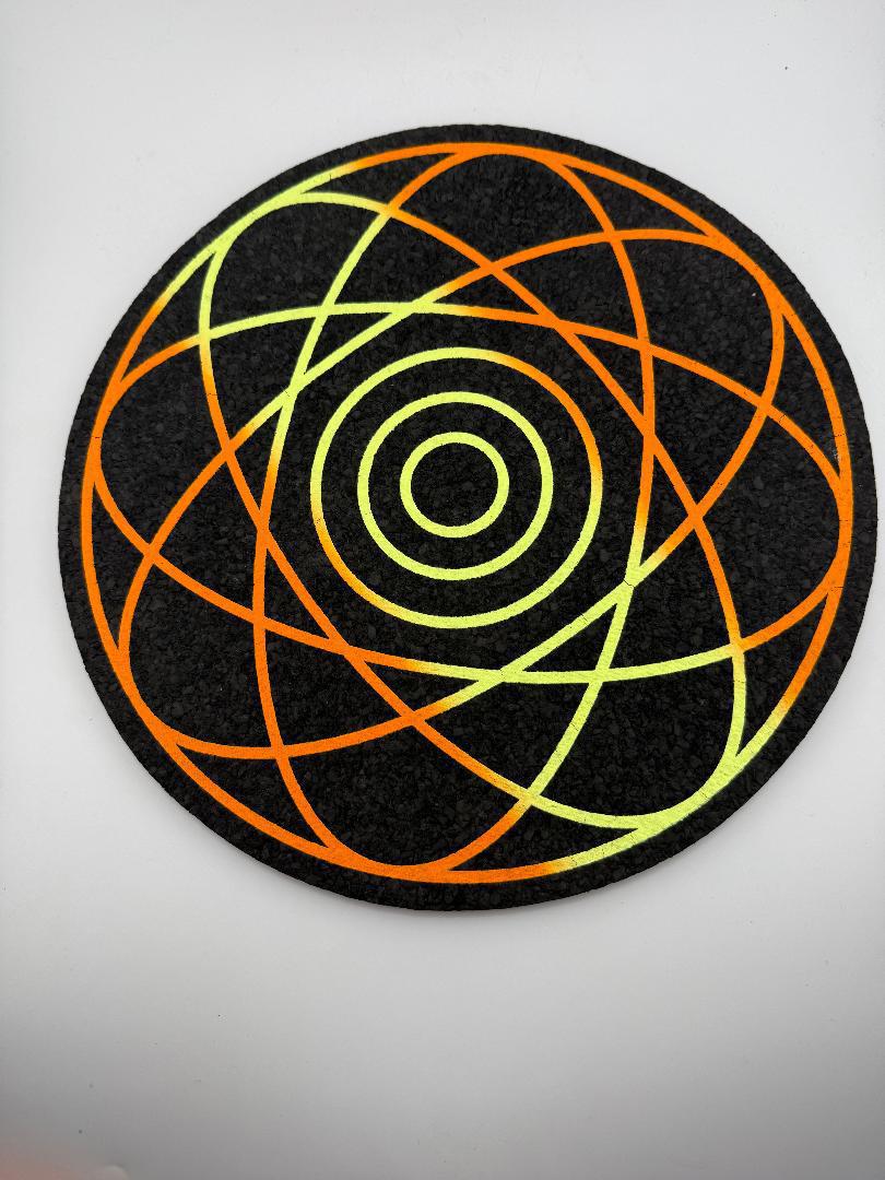 MoodMats Sunrise Nebula 12" foam mat with vibrant UV-reactive design featuring intricate orange and green patterns.