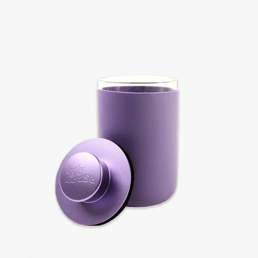 Ugly House Stash Air 9 oz smell-proof storage container in purple with airtight lid, perfect for discreet storage.