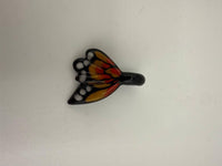Windstar Monarch Pendant in vibrant colors resembling a butterfly, showcasing intricate glass design and craftsmanship.