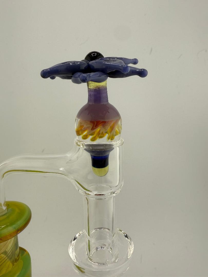 Pablos Glass Flower Slurper Top featuring a colorful glass design and intricate flower details for optimal dabbing.