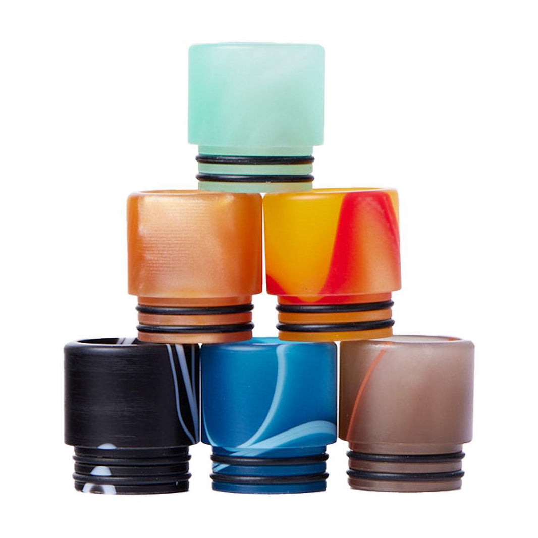 810 Drip Tips - Acrylic in various colors stacked on top of each other, showcasing their design and style.