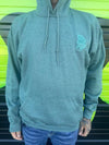 Nikk Drips Hoodie displayed in a stylish, casual setting with a vibrant background.
