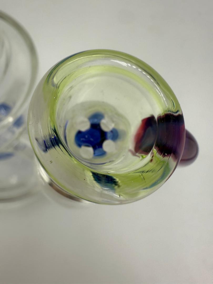 Top view of Lylo Glass 4 Hole 14mm Bowl with colorful design and horn handle, showcasing diffuser holes for improved airflow.