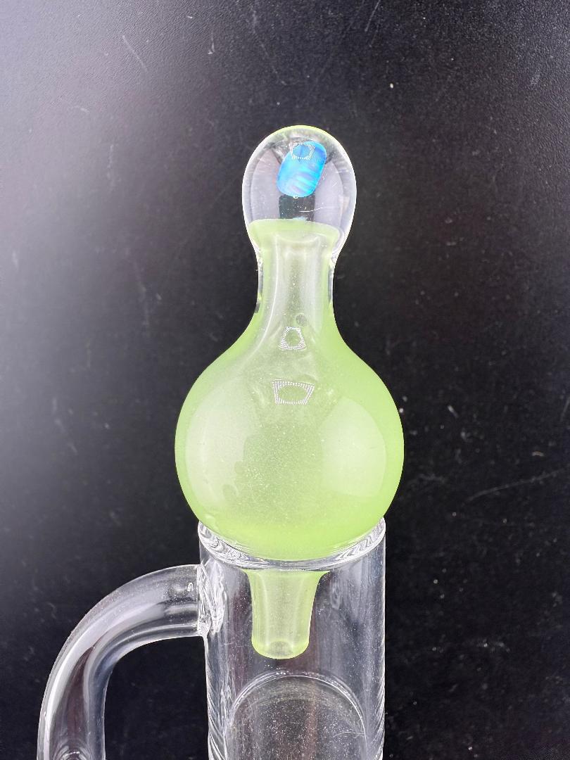 Windstar Glass Bubble Cap in vibrant green, designed for precise airflow with quartz bangers and dab rigs.