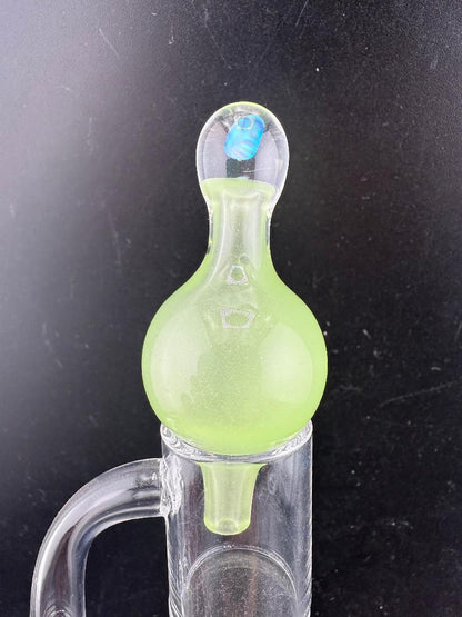 Windstar Glass Bubble Cap in vibrant green, designed for precise airflow with quartz bangers and dab rigs.