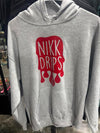 Nikk Drips Hoodie with Vinyl Logo displayed on a gray background, featuring a bold red vinyl design.