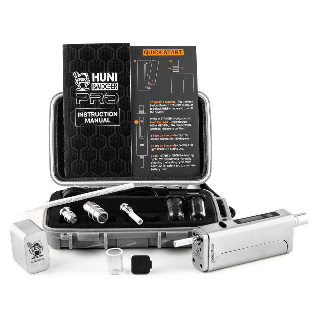 Huni Badger Portable Device Pro with instruction manual and accessories for herbal extracts.