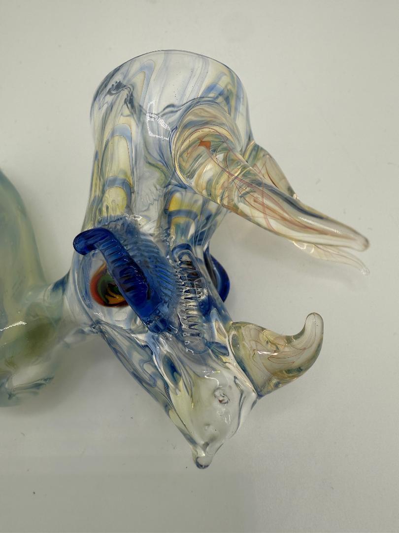 Handcrafted Tuck Glass Triceratops Sherlock Pipe with unique blue and yellow design, featuring intricate craftsmanship.