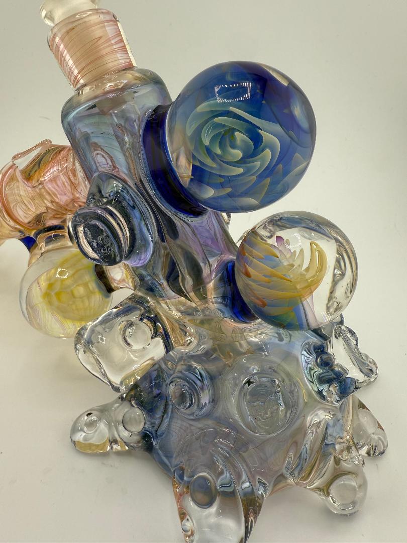 Brando Glass large format fumed hammer with intricate designs, showcasing vibrant colors and artistic craftsmanship.