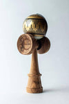 Sweets Kendama Boogie T Gold with gold tama featuring signature design and spliced Amped ken for enhanced play.