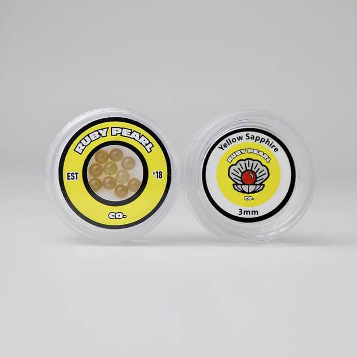 Ruby Pearl Co Yellow Sapphire Terp Pearls in packaging, featuring lab-grown yellow sapphires for dabbing.