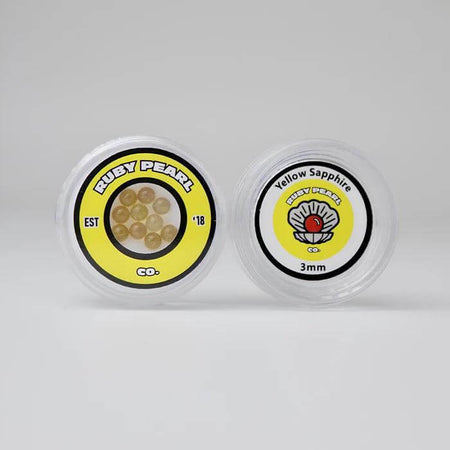 Ruby Pearl Co Yellow Sapphire Terp Pearls in packaging, featuring lab-grown yellow sapphires for dabbing.