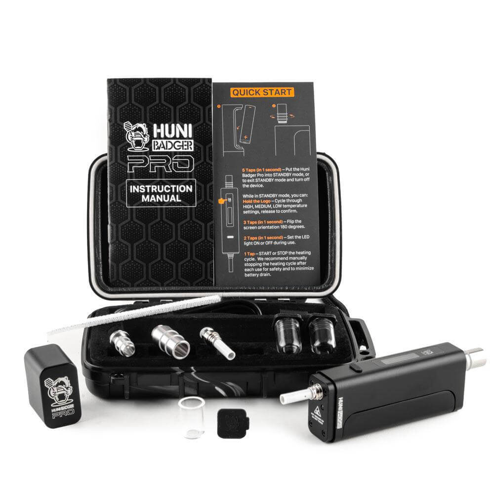 Huni Badger Portable Device Pro with instruction manual and accessories in a black case for easy herbal extract use.