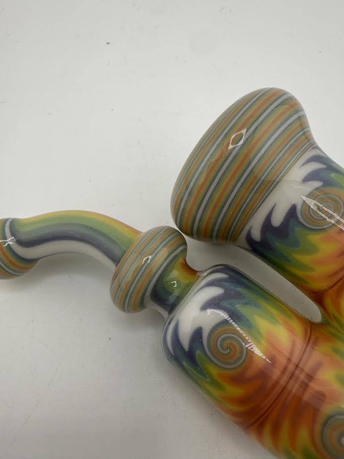 Colorful Mcdoogle Works Sherlock pipe with rainbow swirls and intricate details.
