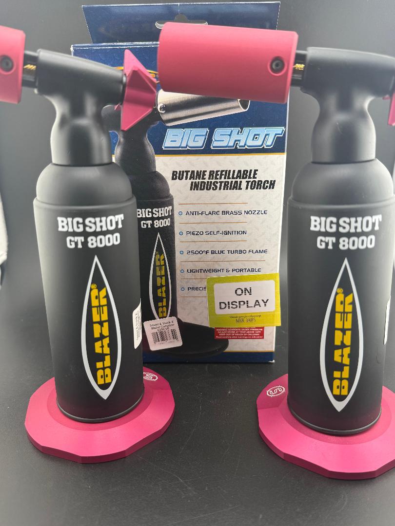 Blazer Big Shot GT 8000 butane torch display featuring dual industrial torches with pink bases.