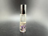 Amethyst crystal perfume roller filled with essential oil, promoting aromatherapy and gemstone energy.