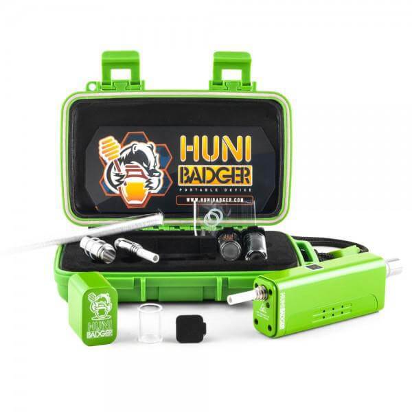 Huni Badger portable device kit in a green case, featuring accessories and logo for herbal extraction enjoyment.