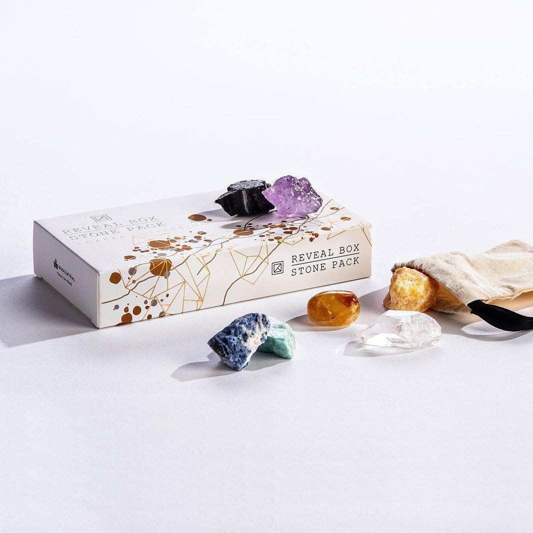 Reveal Box Stone Pack featuring chakra stones, vibrant colors, and a pouch for meditation and energy work.