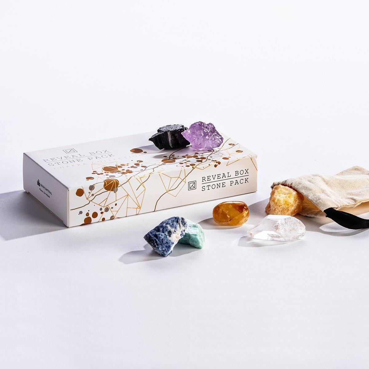 Reveal Box Stone Pack featuring chakra stones, vibrant colors, and a pouch for meditation and energy work.