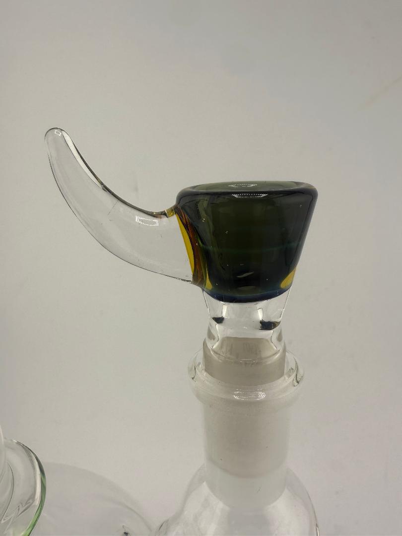 Close-up of Glass Distractions martini bowl with horn handle, featuring vibrant colors and unique design.