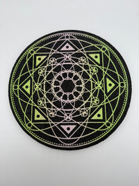 Slime Grid 12" foam mat with UV-reactive print featuring bold geometric designs and vibrant slime drips.