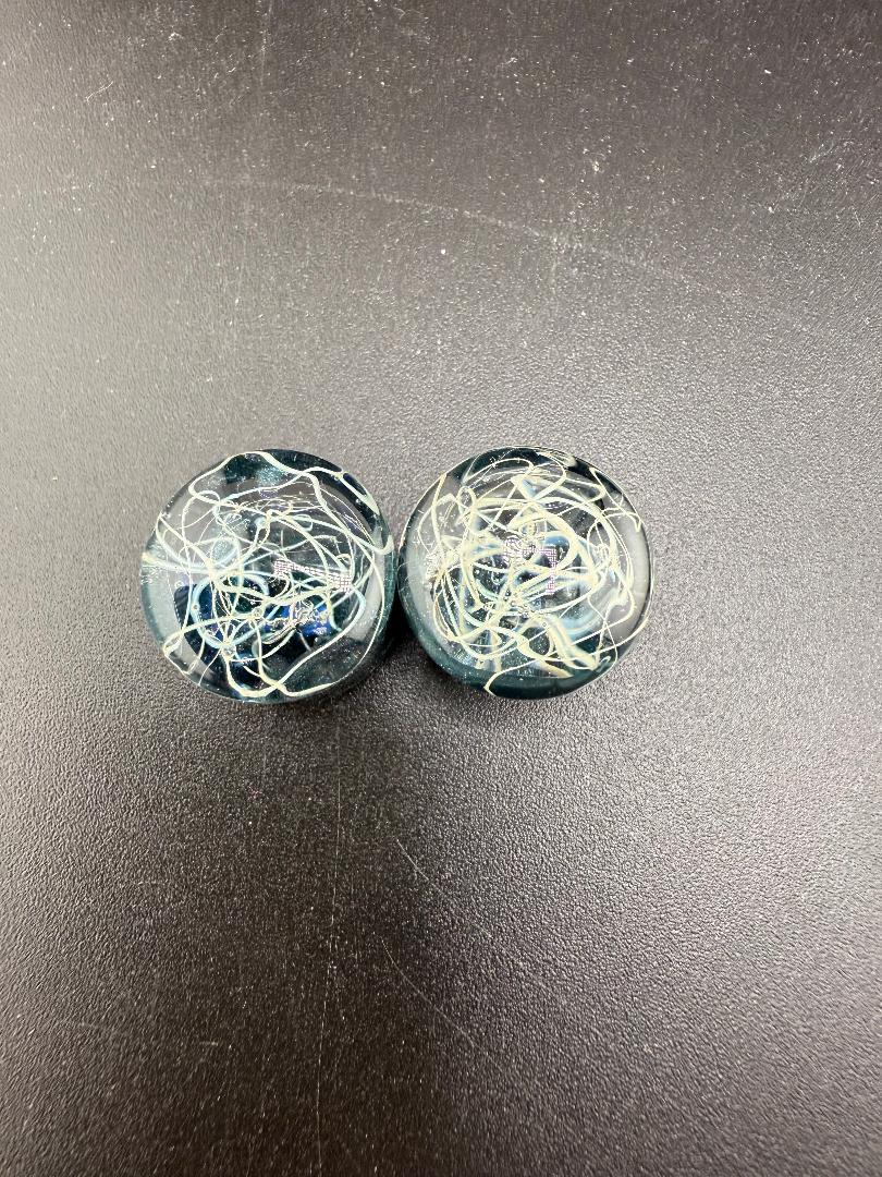 Mop head glass gauges in blue tones with intricate white swirl patterns, handcrafted borosilicate glass plugs, 11/16" size.