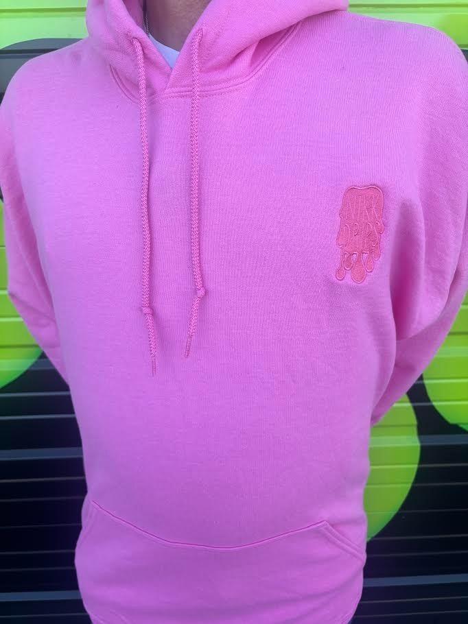 Nikk Drips Hoodie displayed in bright pink color, featuring a stylish design and heavy blend fabric for comfort.