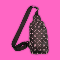Blazy Susan Crossbody Bag Black with stylish design on a pink background, showcasing its compact and functional features.