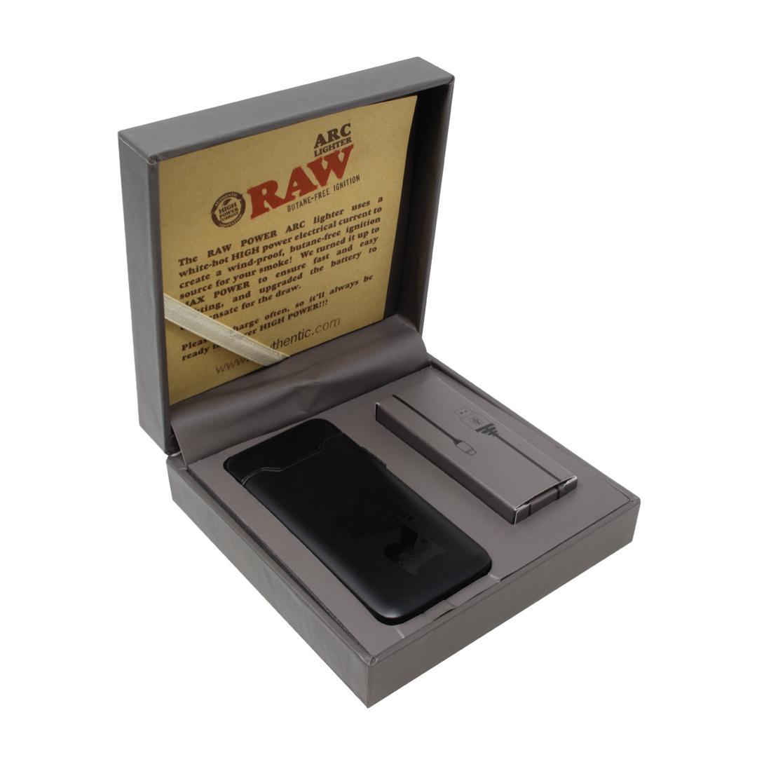 RAW Arc Lighter in packaging with information card and USB charging cable, showcasing its butane-free ignition.