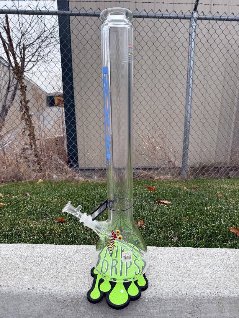 ROOR Glass Zeaker 22" 60 x 9mm Thickness 14mm 45 - Clear w/ Blue Bake Ons displayed on grass with fun design.