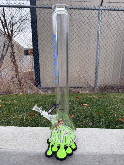 ROOR Glass Zeaker 22" 60 x 9mm Thickness 14mm 45 - Clear w/ Blue Bake Ons displayed on grass with fun design.